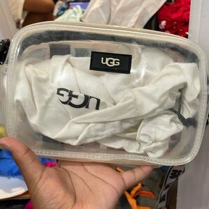 I am selling this black clear ugg purse.